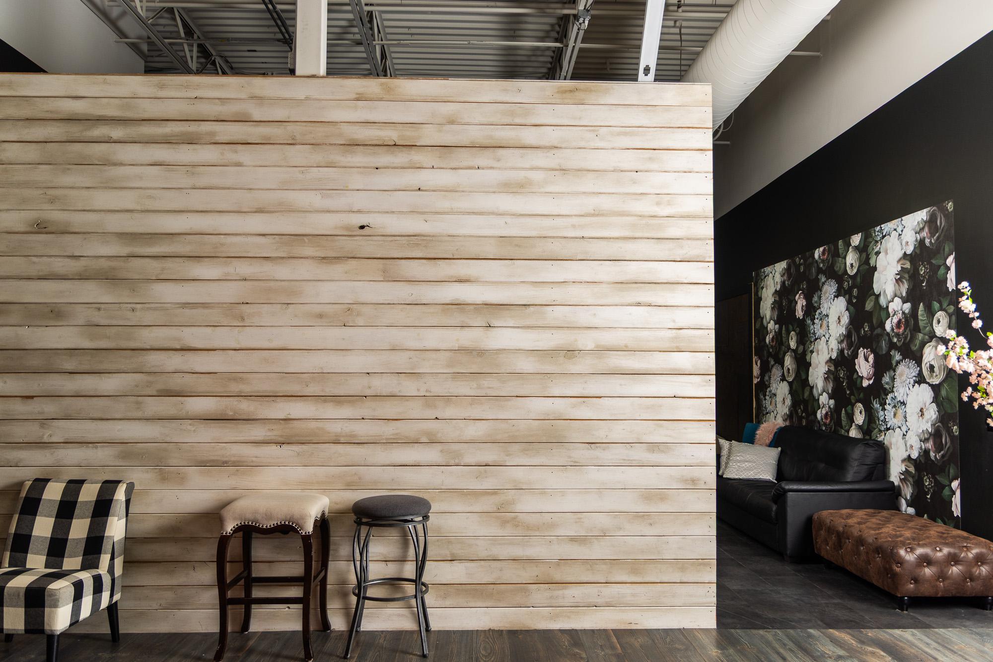 Whitewashed plank wall in the studio lounge