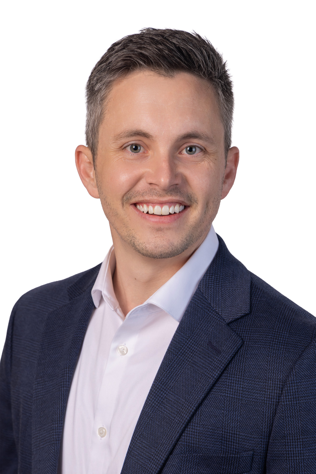 Young executive in a navy blazer and white shirt on white